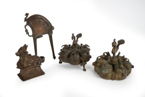 An Indian cast bronze bull statue; together with two bronze spice pots and a tobacco cutter, 19th/20th century, (4 items), the largest 10cm high.