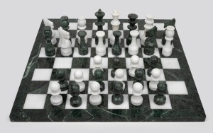 A vintage Italian green and white marble chess set, 20th century, the board 46 x 46cm.