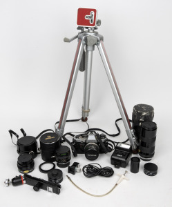 VARIOUS MANUFACTURERS: Collection remainder including a 1979 Olympus OM-10, a tripod, three lenses in lens cases, and more. (14 items)