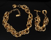 YVES SAINT LAURENT gold plated necklace and matching bracelet in original box of purchase, ​​​​​​​the necklace 50cm long.