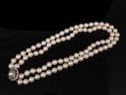 A double strand cultured pearl choker with white gold and diamond clasp, 34cm long. - 2