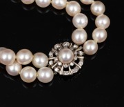 A double strand cultured pearl choker with white gold and diamond clasp, 34cm long. - 3