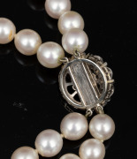 A double strand cultured pearl choker with white gold and diamond clasp, 34cm long. - 4