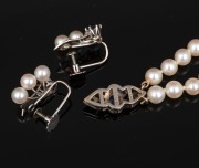 A double strand cultured pearl bracelet with 9ct white gold, diamond and blue sapphire clasp; together with a pair of 9ct white gold, pearl and sapphire earrings, 20th century. - 2