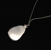 A sterling silver mounted pearl shell pendant on sterling silver chain, housed in a MIKIMOTO branded plush box, ​​​​​​ ​​​​​​​the pendant 3.5cm high, the chain 60cm long. - 3