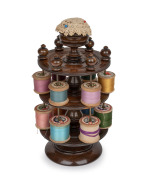 An antique English turned timber cotton reel dispenser with pin cushion top, 19th century, 24cm high.
