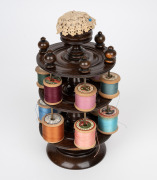 An antique English turned timber cotton reel dispenser with pin cushion top, 19th century, 24cm high. - 2