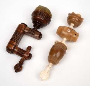 Two antique English sewing clamps with pin cushion tops, one in turned timber, the other in whalebone and vegetable ivory, 19th century or possibly earlier, the larger 14cm high.