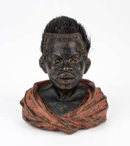 An antique Austrian cold painted bronze figural pen wipe in the form of a Nubian bust, circa 1900, 10cm high.