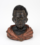 An antique Austrian cold painted bronze figural pen wipe in the form of a Nubian bust, circa 1900, 10cm high.