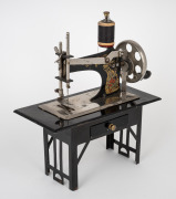 An antique German miniature sewing machine, early 20th century, ​​​​​​​21cm high. - 2