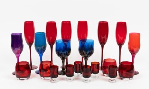 Assorted coloured glassware including a fine set of six ruby champagne glasses, (21 items), the largest 25cm high.