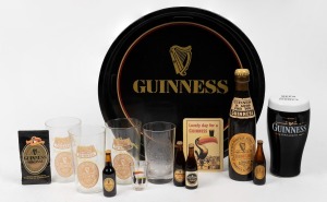 GUINNESS range of collectables including porcelain money box, drinking glasses, drinks tray, brush etc., (14 items), the tray 32cm diameter.