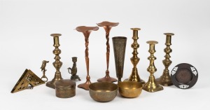 Three pairs of copper and brass vintage candlesticks, Islamic copper finger bowls and circular lidded box, kookaburra bottle opener, figural candle holder, vase, dish and napkin holder, 20th century, (14 items), the largest 27cm high.