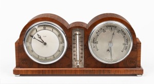 A vintage English desk clock compendium with mercury thermometer and barometer, housed in walnut case, circa 1925, 14cm high, 29cm wide, 7cm deep.
