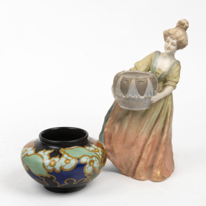 An antique Austrian porcelain statue of a young lady, 19th century, together with a GOUDA Dutch pottery vase with floral decoration, 20th century (2 items), 26cm and 8.5cm high