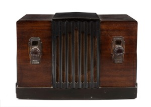 AIRZONE vintage two toned walnut veneered mantle radio with bakelite knobs and ebonised trim, 26cm high.