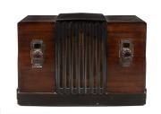 AIRZONE vintage two toned walnut veneered mantle radio with bakelite knobs and ebonised trim, 26cm high.