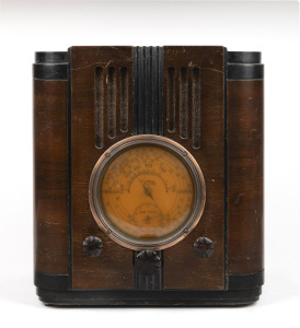 TASMA vintage walnut veneered mantle radio with ebonised trim, 34cm high.