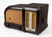 MONARCH vintage mantle radio in brown bakelite case, circa 1946. Note: Glass dial cracked and cord cut. 24cm high.
