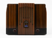STROMBERG CARLSON vintage walnut cased mantle radio with bakelite knobs and blue enamel badge, 27cm high.