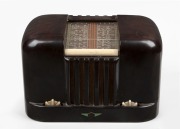TASMA vintage brown bakelite mantle radio with cream knobs and roll bar channel selector, circa 1940s, 19.5cm high.