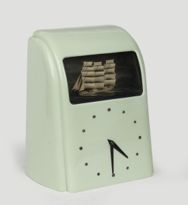 VITASCOPE automata English clock radio in later green finished bakelite case with rocking three masted ship and electric clock to front, circa late 1940s, 32cm high.