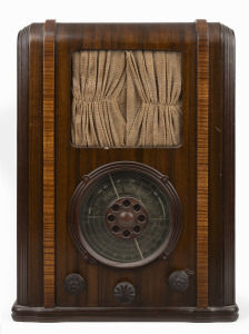 HEALING "Golden Voice" tombstone mantle radio in walnut case, 45cm high.