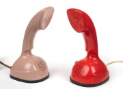 ERICSSON two vintage coloured plastic "Cobra" phones, 21.5cm high.