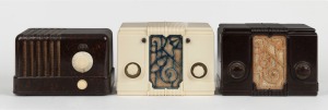 Three vintage bakelite mantle radios in brown and cream, mid 20th century, the largest 14cm high.