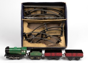 HORNBY vintage clockwork train with track in original box. Fair condition only.