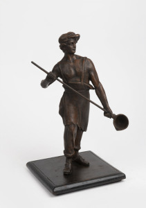 An antique patinated spelter figure of a foundry figure mounted on later timber base, early 20th century, 34cm high.