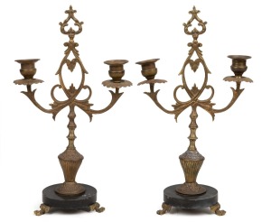 A pair of antique French gilt spelter and black slate two branch candelabra, 19th century, 34cm high.