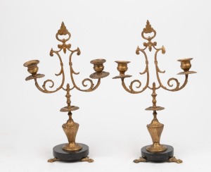 A pair of antique French gilt spelter and black slate two branch candelabra, 19th century, 33.5cm high.