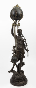 An antique French figural mystery swinging timepiece with eight day time only movement on turned wooden plinth with applied title plaque "Prisonniere", circa 1900, 73cm high.