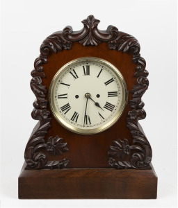 An antique English spring table clock, circa 1860. Mahogany scroll style case with applied floral carved decoration with circular painted cream dial with Roman numerals, spade hands and cast brass locking bezel. Two train eight day fusee movement with anchor escapement striking the hours on a single bell. 51cm high.
