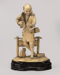 An antique Japanese carved ivory statue of a peasant with a chicken, on carved wooden base, Meiji period, ​​​​​​​17cm high overall including base.