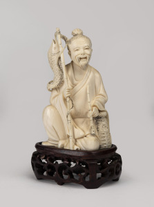 A Chinese carved ivory statue of a seated fisherman on carved timber base, early to mid 20th century, 13cm high overall including base.