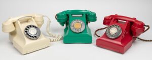 Three vintage coloured bakelite telephones.