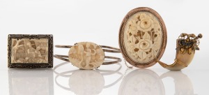 An antique carved ivory brooch in 9ct rose gold mount (missing safety clasp), together with a gold mounted claw brooch (missing pin) and a Chinese carved ivory brooch and bangle, 19th/20th century, (4 items), the oval 9ct gold mounted example 5cm high.