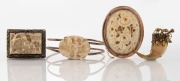 An antique carved ivory brooch in 9ct rose gold mount (missing safety clasp), together with a gold mounted claw brooch (missing pin) and a Chinese carved ivory brooch and bangle, 19th/20th century, (4 items), the oval 9ct gold mounted example 5cm high.