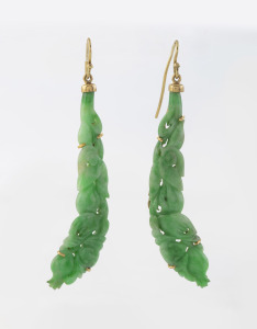 A pair of Chinese carved jade earrings mounted in 14ct gold, 20th century, 7.5cm high.