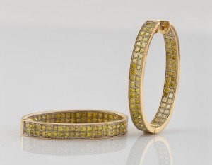 A pair of 18ct gold earrings, set with a double row of cut yellow diamonds, late 20th century, stamped "750", 4.3cm high, 18.6 grams total.