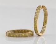 A pair of 18ct gold earrings, set with a double row of cut yellow diamonds, late 20th century, ​​​​​​​stamped "750", 4.3cm high, 18.6 grams total.