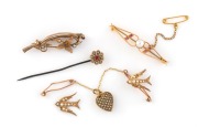 Two antique 9ct gold bar brooches, set with pearls and coloured stones; together with a 9ct gold lapel brooch with seed pearls adorning swallows and heart (A/F), plus a 9ct gold floral style stick pin, set with red stone and seed pearls, 19th/20th century