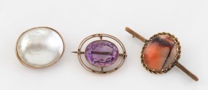 Three antique 9ct gold brooches, set with pearl shell, agate and purple stone, 19th/20th century, the largest 5.2cm wide, 22.8 grams total (including stones).