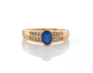 A vintage 9ct gold and sapphire ring with two rows of brilliant cut diamonds on each shoulder, 20th century, stamped "375", ​​​​​​​2.4 grams.