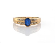 A vintage 9ct gold and sapphire ring with two rows of brilliant cut diamonds on each shoulder, 20th century, stamped "375", ​​​​​​​2.4 grams.