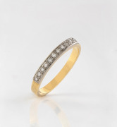 An 18ct gold ring, set with a row of ten brilliant cut white diamonds mounted in platinum, stamped "750", ​​​​​​​2.5 grams total.