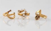 An 18ct gold interchangeable three-piece ring set, with pearls, diamonds and red stones, 10.8 grams total.